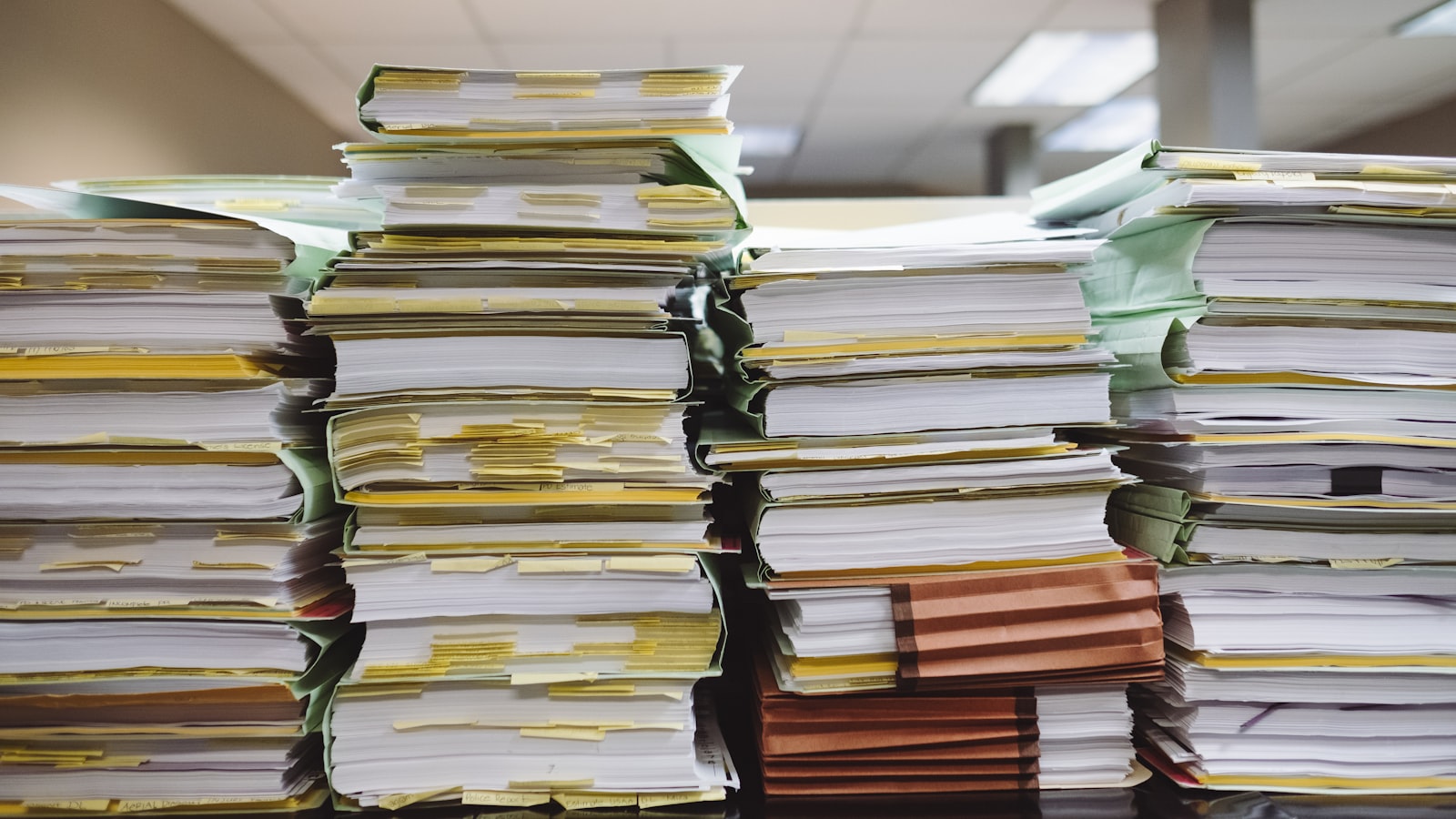 Stacks of customs and shipping paperwork filed for imported goods