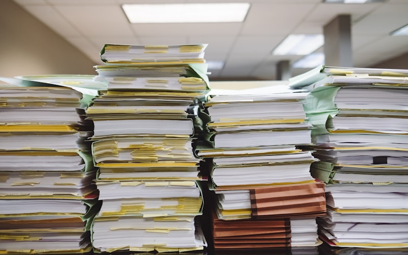 Stacks of customs and shipping paperwork filed for imported goods